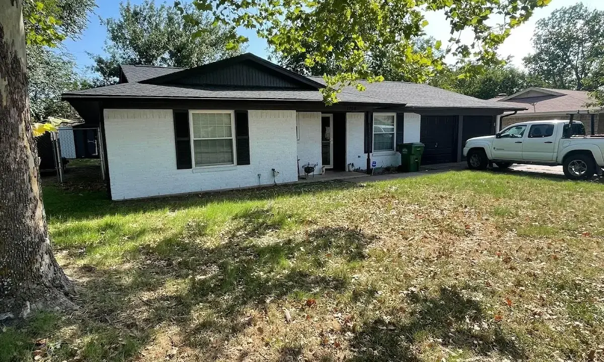 Professional roofing crew working on a residential roof in Bozeman